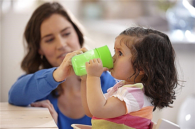 How to teach a child to drink from a mug on their own